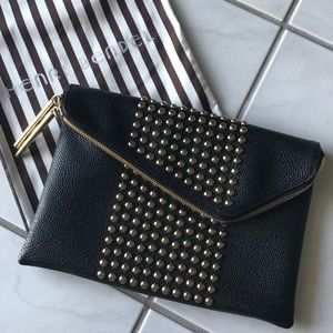 Henri Bendel black w/gold grommet clutch/crossbody